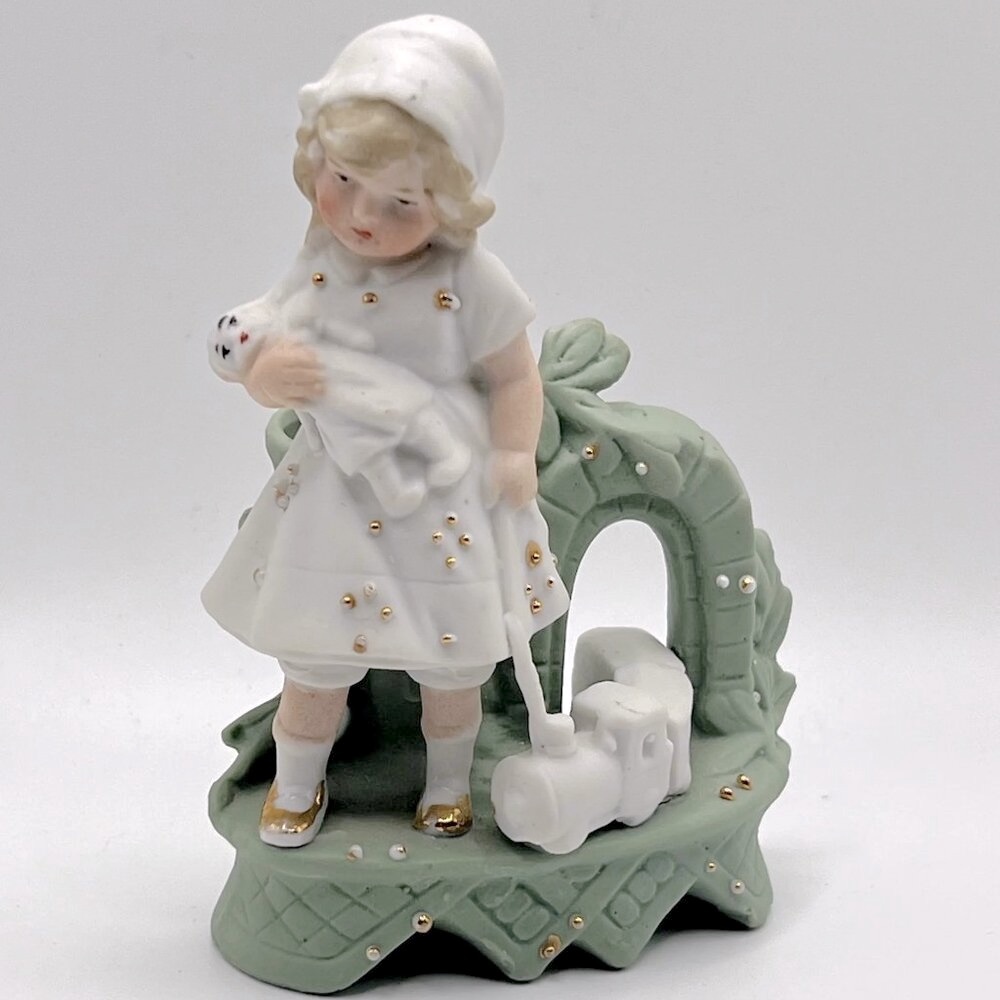 Charming Porcelain Girl Figurine with Baby doll and Toy Train